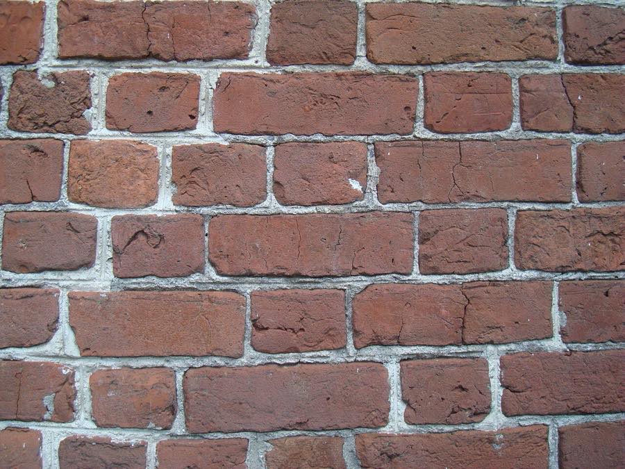 Close-up of Flemish bond brickwork with alternating headers and stretchers in handmade 18th-century brick
