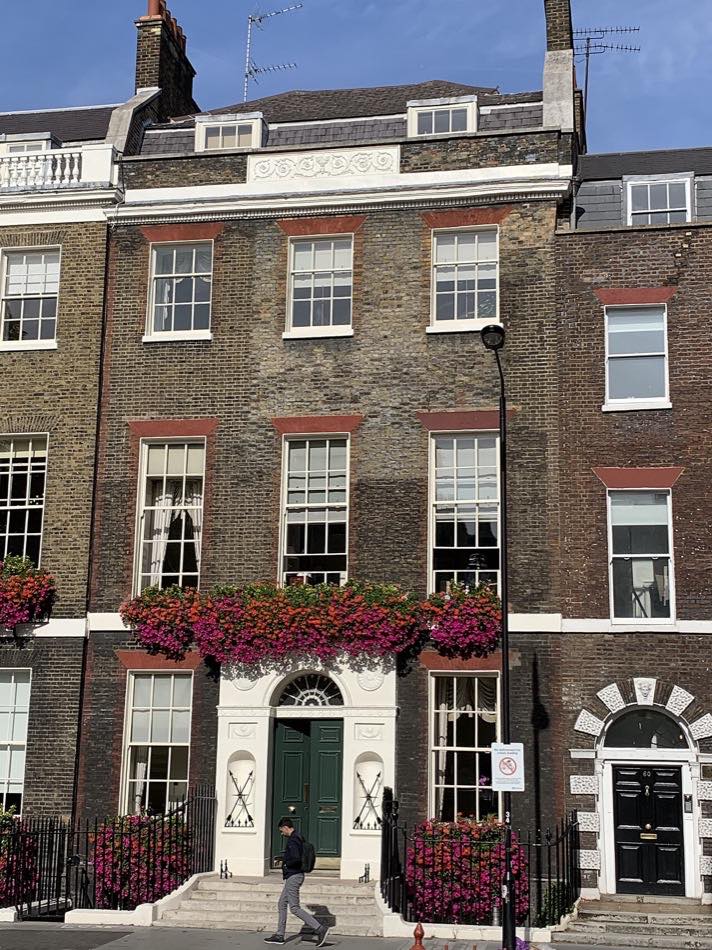 Georgian townhouse at 1 Bedford Square, London, with symmetrical rows of sash windows and a fanlight above the front door